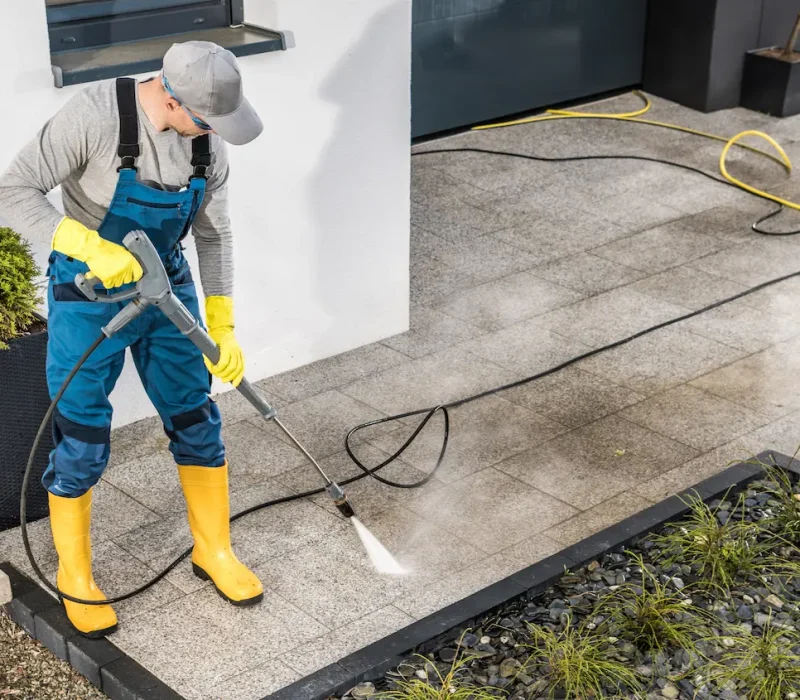 men-pressure-washing-his-house-surrounding-2026-01-08-22-51-31-utc